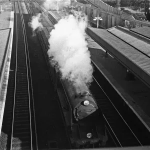 Express train thunders through Surbiton station. November 1938 Express train thunders through Surbiton station. November 1938