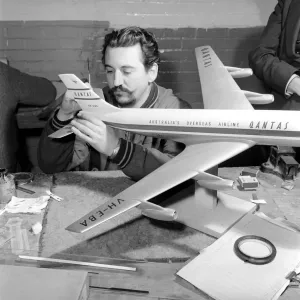 Print of Men Making Model Planes in a Factory Circa 1960 Print of Men Making Model Planes in a Factory Circa 1960