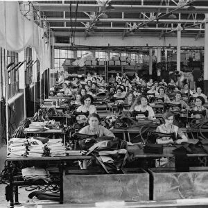 A factory scene in 1935 showing women and their Singer sowing machines