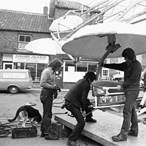 Fairground workers assembly a ride in Stokesley in preparation of the annual fair