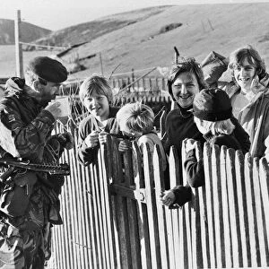 FALKLANDS WAR TASK FORCE - SOLDIER TALKING TO CHILDREN & DRINKING HOT DRINK - April 1982