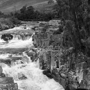 Falls of Glascarnoch River in Ross and Cromarty. Visitors watch salmon leaping the falls Falls of Glascarnoch River in Ross and Cromarty. Visitors watch salmon leaping the falls