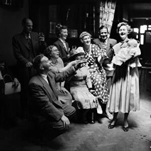 Families : Chirstening. The Irons family toast Lee after the Christening. July 1953 D3465