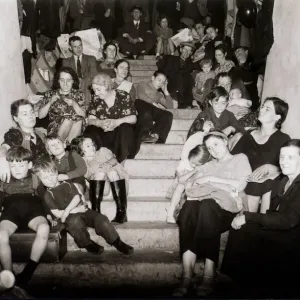 Families take cover from the Luftwaffe bombing of London in this disused London