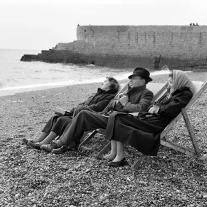 A family have the whole beach to themselves during a visit to the beach in Springtime