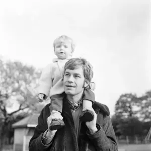 Alan Rothwell and his 2-year-old son Tody on swings at a playground, Print Alan Rothwell and his 2-year-old son Tody on swings at a playground, Print