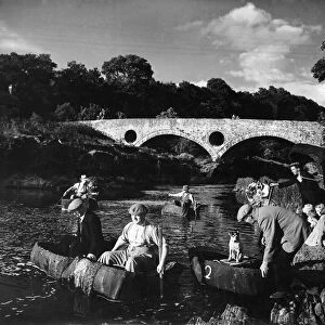 By the famous Cenarth bridge the coracle fishers set out for a days fishing