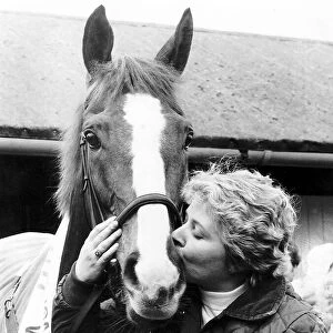 famous Racehorse Corbiere, winner of the 1983 Grand National is kissed by his happy