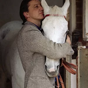 Famous racehorse Desert Orchid in his stables with owner Richard Burridge