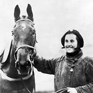 Famous racehorse Golden Miller with owner Dorothy Paget after winning the 1934 Grand
