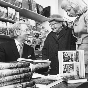 Norman Painting Meets Distant Relative at Book Signing Print