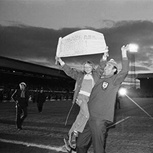 A fan jumps into the arms of Sunderland manager Bob Stokoe during the homecoming