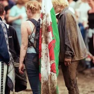 Fans covered in mud, at Margam Park to watch Catatonia performing, South Wales Fans covered in mud, at Margam Park to watch Catatonia performing, South Wales