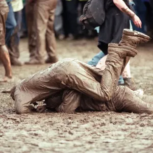 Fans covered in mud, at Margam Park to watch Catatonia performing, South Wales Fans covered in mud, at Margam Park to watch Catatonia performing, South Wales