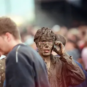 Fans covered in mud, at Margam Park to watch Catatonia performing, South Wales Fans covered in mud, at Margam Park to watch Catatonia performing, South Wales