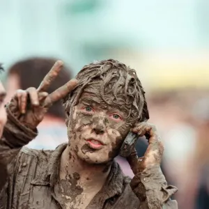 Fans covered in mud, at Margam Park to watch Catatonia performing, South Wales Fans covered in mud, at Margam Park to watch Catatonia performing, South Wales