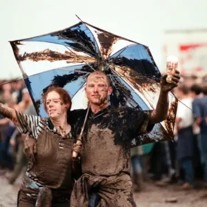Fans covered in mud, at Margam Park to watch Catatonia performing, South Wales Fans covered in mud, at Margam Park to watch Catatonia performing, South Wales