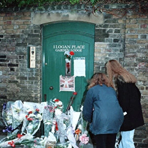 Fans gather outside the Kensington, West London, home of singer Freddie Mercury who died