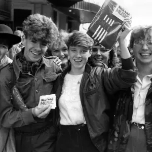Fans of Simple Minds, Rock Group, celebrate after managing to purchase tickets for their