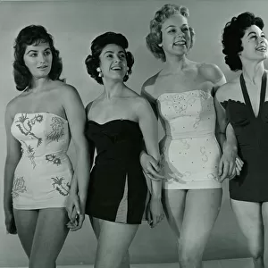 Fashion 1950s Four models wearing swimwear / swimming costumes in a corset style