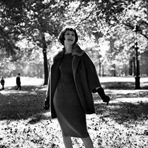 Fashion 1960s. Thats why the lady is a vamp! Ankle-deep among the falling leaves of
