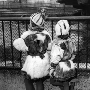 Fashion. Never mind the weather. Here are two young visitors to London who couldn