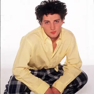 Fashion - Model Kate Moss brother Nick crouching wearing tartan style trousers Fashion - Model Kate Moss brother Nick crouching wearing tartan style trousers