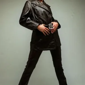 Fashion A model wearing black leather jacket and trousers 1996 Fashion A model wearing black leather jacket and trousers 1996