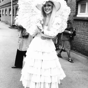 Fashionable racegoer with parasol at Royal Ascot in 1981