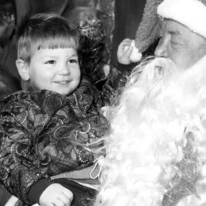 Father Christmas (aka Tom Mathieson) with two year old Scott McLaughlin in a city Father Christmas (aka Tom Mathieson) with two year old Scott McLaughlin in a city