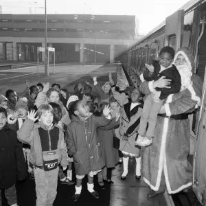 Father Christmas arriving at Snow Hill station yesterday being greeted by enthusiastic Father Christmas arriving at Snow Hill station yesterday being greeted by enthusiastic