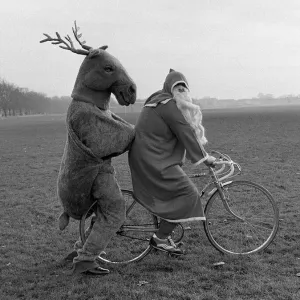 Father Christmas and his Rudolf the Reindeer - bike stunt A©Mirrorpix circa 1980 Father Christmas and his Rudolf the Reindeer - bike stunt A©Mirrorpix circa 1980