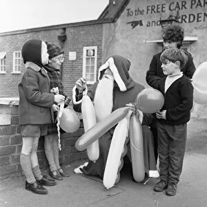 Father Christmas seen here handing out balloons in Tilhurst. 18th November 1966