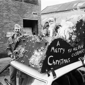 Father Christmas on top of a taxi. Teesside, December 1985