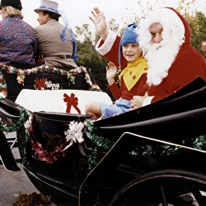 Father Christmas travelling in style with helper, six year old John Stubbs, of Billingham