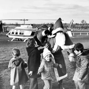 Father Christmas visits a group of very excited children by helicopter, Teesside Father Christmas visits a group of very excited children by helicopter, Teesside