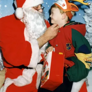 Father Christmas and five year old Kenneth Andrew Dickons of Middlesbrough samples Father Christmas and five year old Kenneth Andrew Dickons of Middlesbrough samples