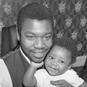 Father with his toddler son. December 1969 Z11609-005