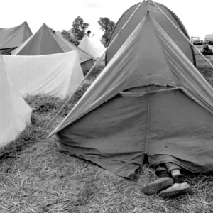 Feet sticking out of a tent at the Isle of Wight Pop Festival 30th August 1969
