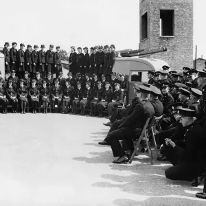Female firefighters pose with their commandant for a photograph before leaving their