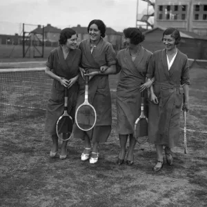 Female Hoover factory workers walking on a tennis court outside the factory building Female Hoover factory workers walking on a tennis court outside the factory building