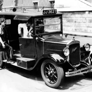 A female passenger entering one of the new London taxi cabs that can travel up to 50