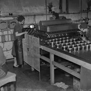 Female workers filling tins with Mansion Polish at a factory Female workers filling tins with Mansion Polish at a factory