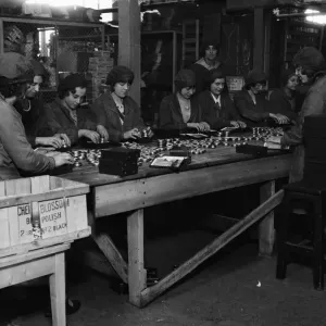 Female workers packing tins of Cherry Blossom boot polish Female workers packing tins of Cherry Blossom boot polish
