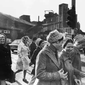 Black and white print of female workers walking to a staff canteen Black and white print of female workers walking to a staff canteen