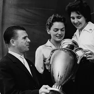 Ferenc Puskas Real Madrid football player shows off the European Cup Trophy to two