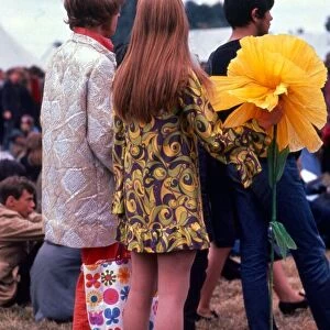 Festival of the Flower Children Hippy hippies with giant large yellow flower