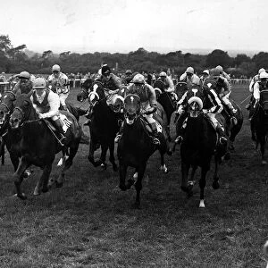 The field approach the mile post, with the eventual Derby winner Crepello 1957