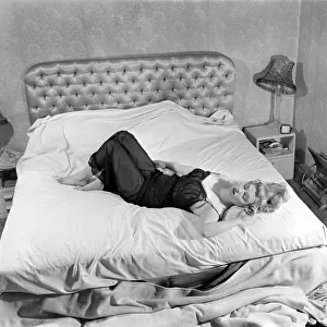 Film actress Sandra Dorne sleeping. December 1953 D7608