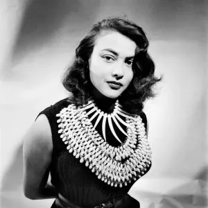 Film actress Tessa Prendergast a wearing a necklace. January 1953 D471